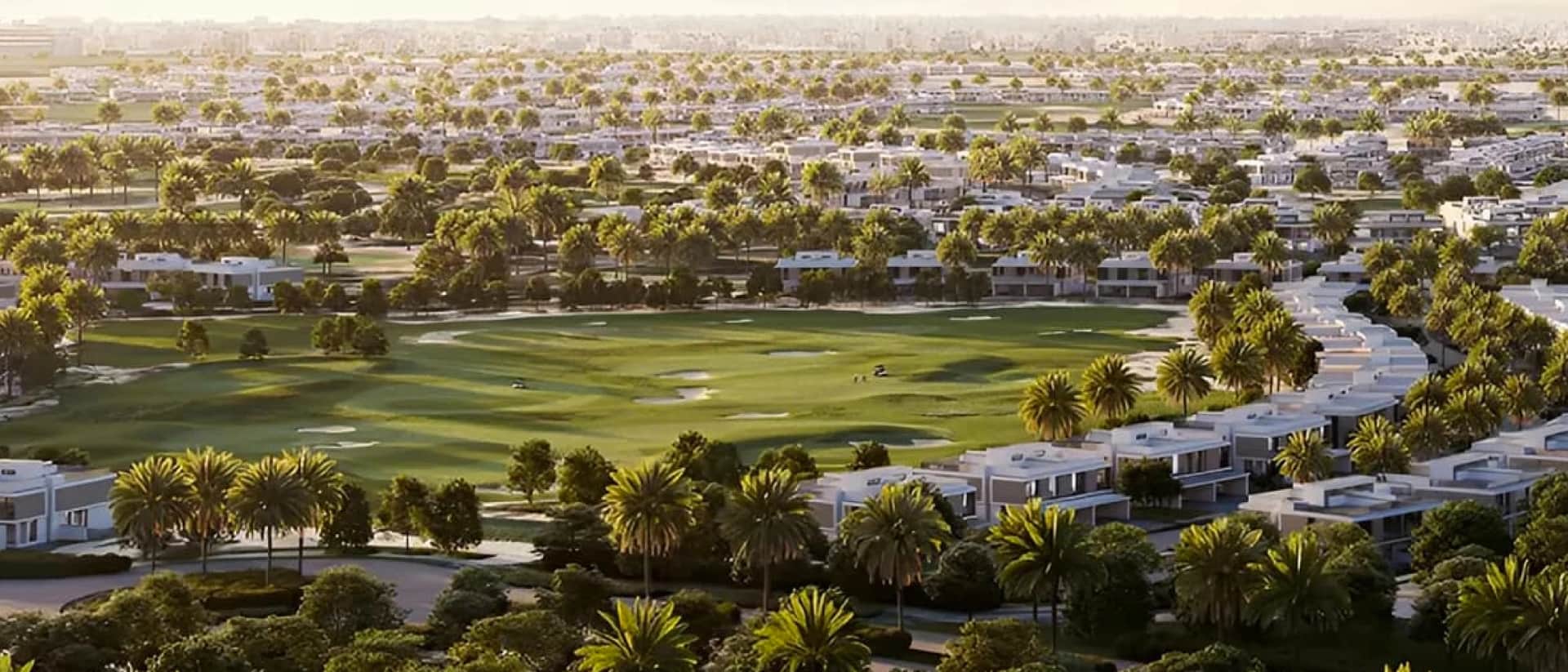 Aerial view of a community with a golf course and many houses