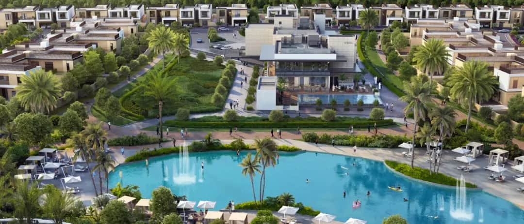 Aerial view of community with pool and villas