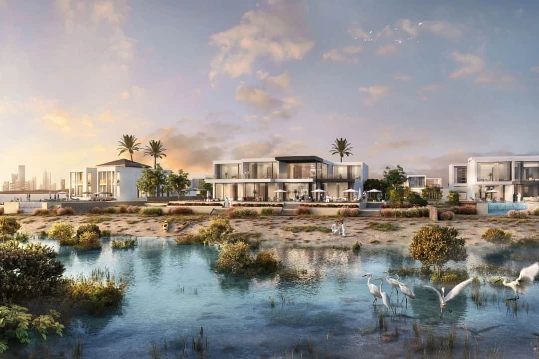 Luxury waterfront villas surrounded by water and lush greenery