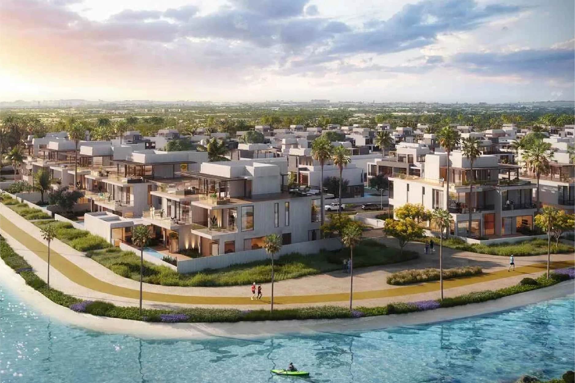 Luxurious villas by the waterfront with palm trees and walking paths