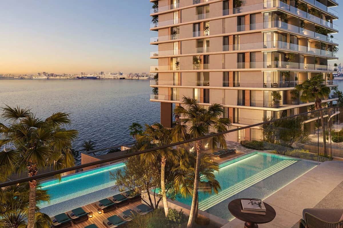 Waterfront luxury apartment with infinity pool and palm trees