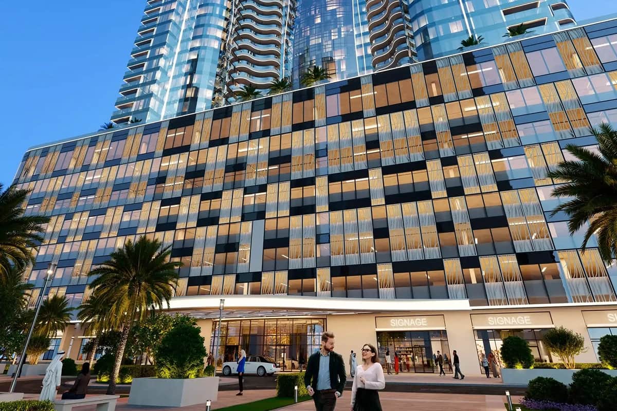 Modern building with glass exterior and people walking outside