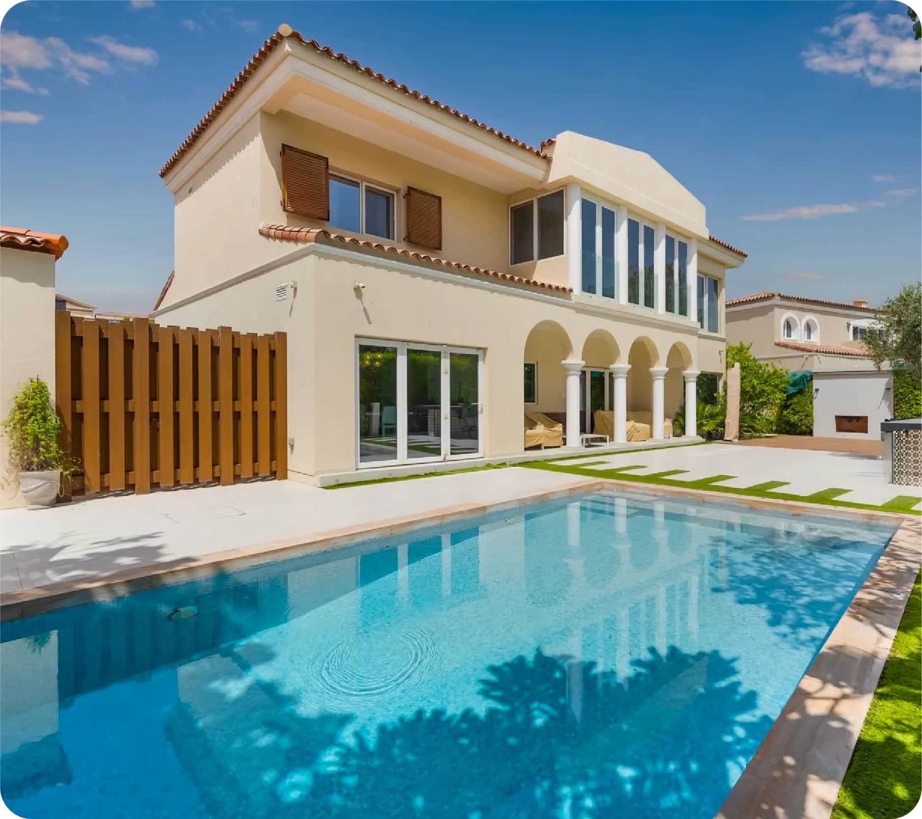 Beige villa with a pool in Green Community West