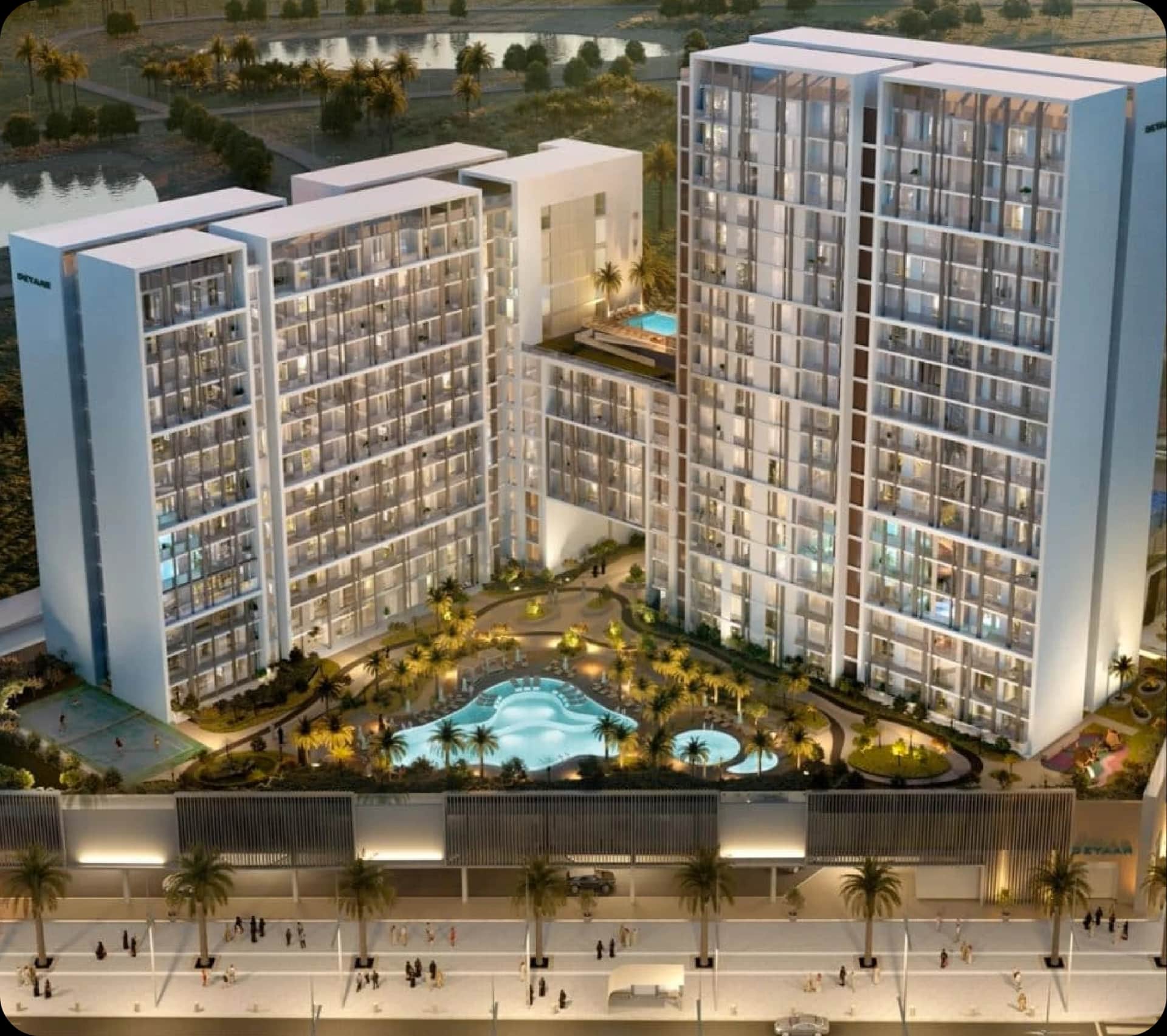 Modern high-rise apartment complex with pools and landscaping