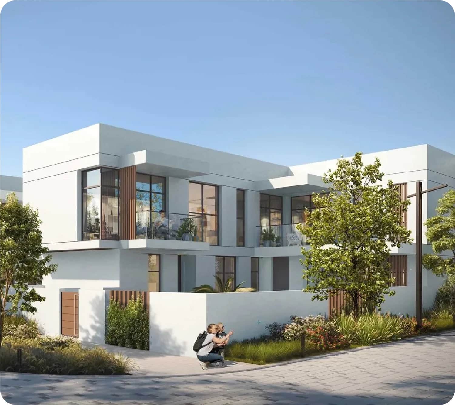 Modern villa exterior with greenery and photographer
