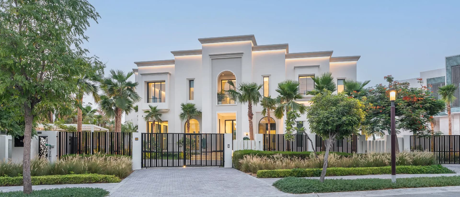 Modern white villa with a landscaped yard