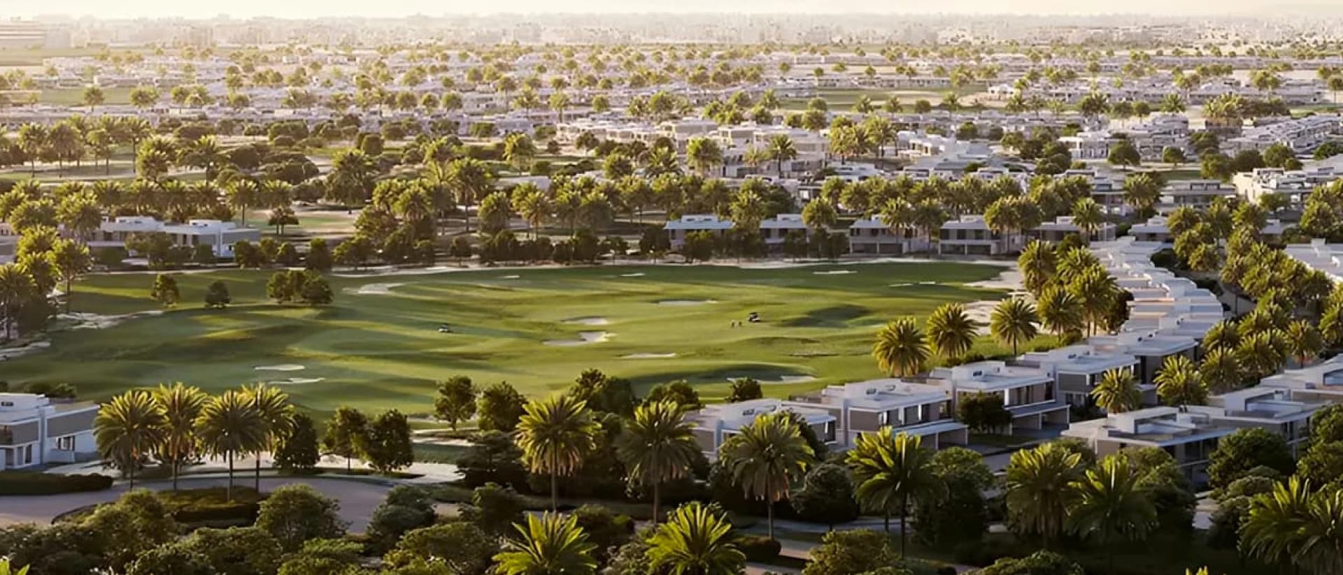 Aerial view of a community with a golf course and many houses