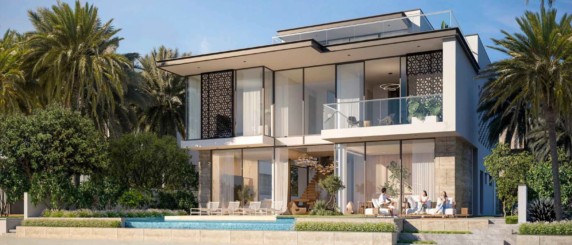 A modern, multi-story villa with a pool and outdoor seating area