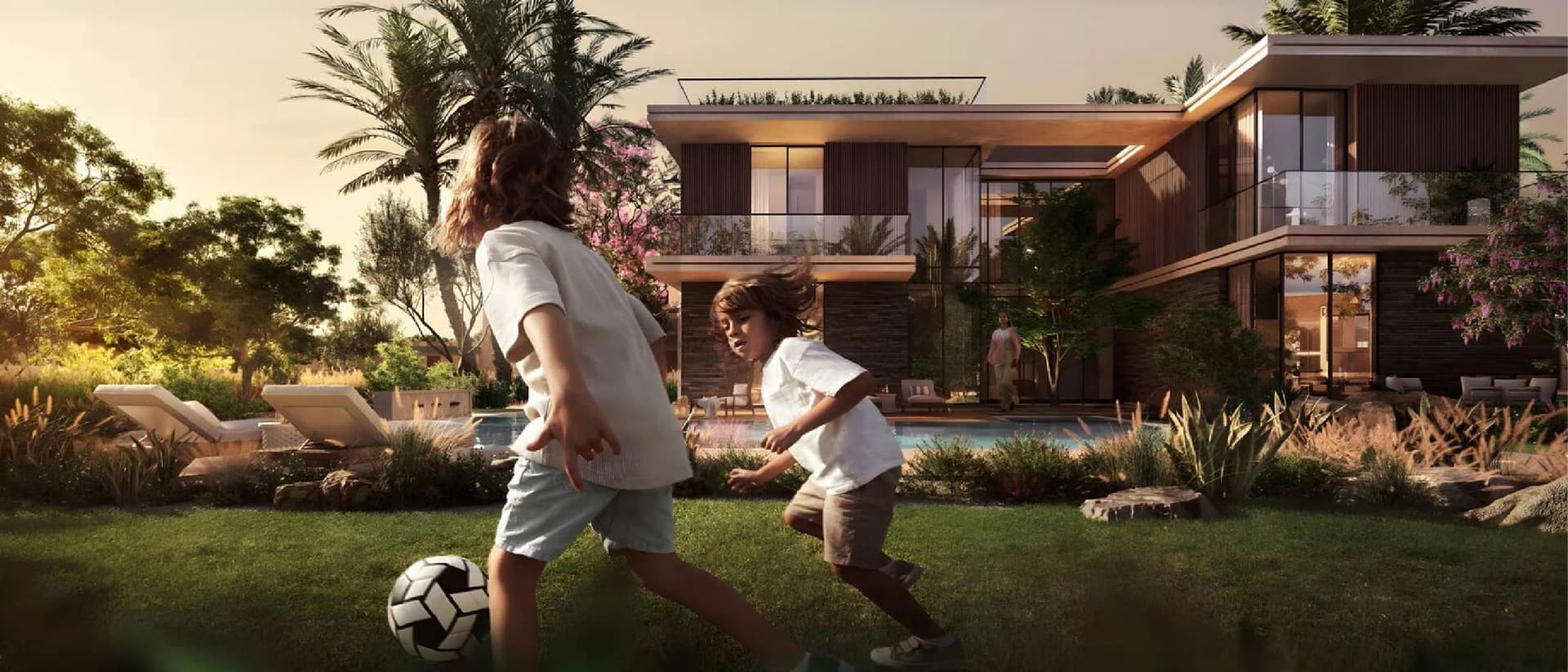 Children play soccer in front of modern house