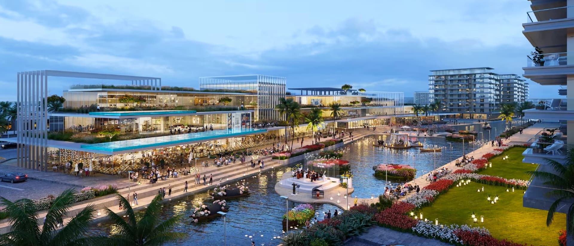 Evening view of a bustling waterfront promenade with modern architecture