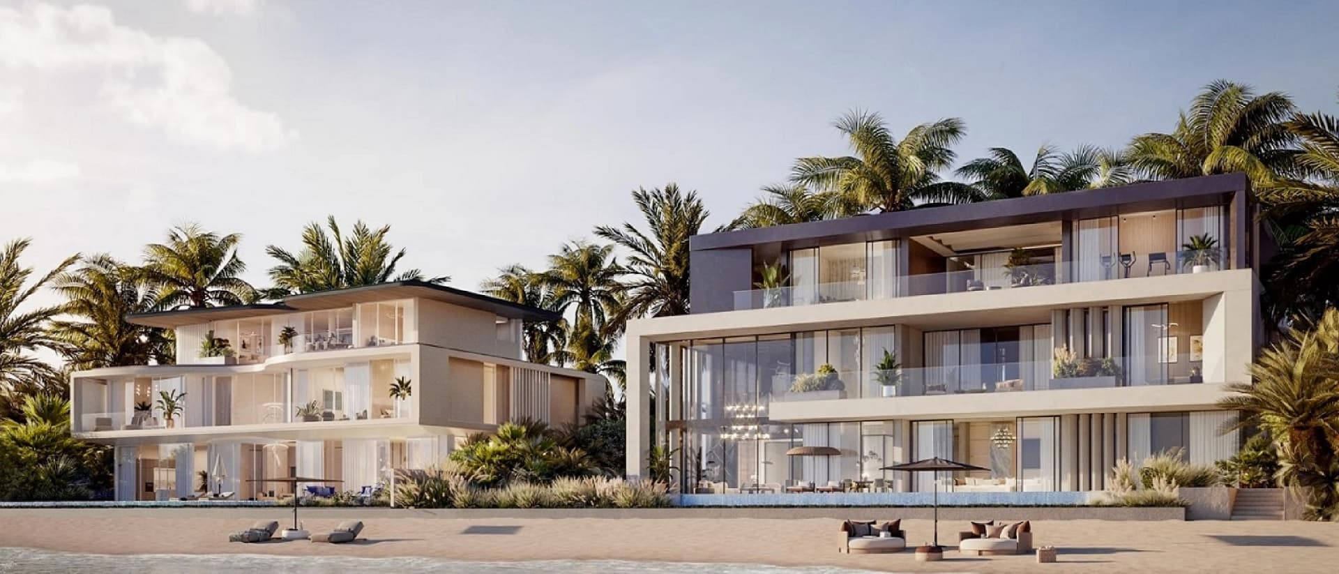 Modern multi-story villas on a sandy beach, with palm trees and ocean views