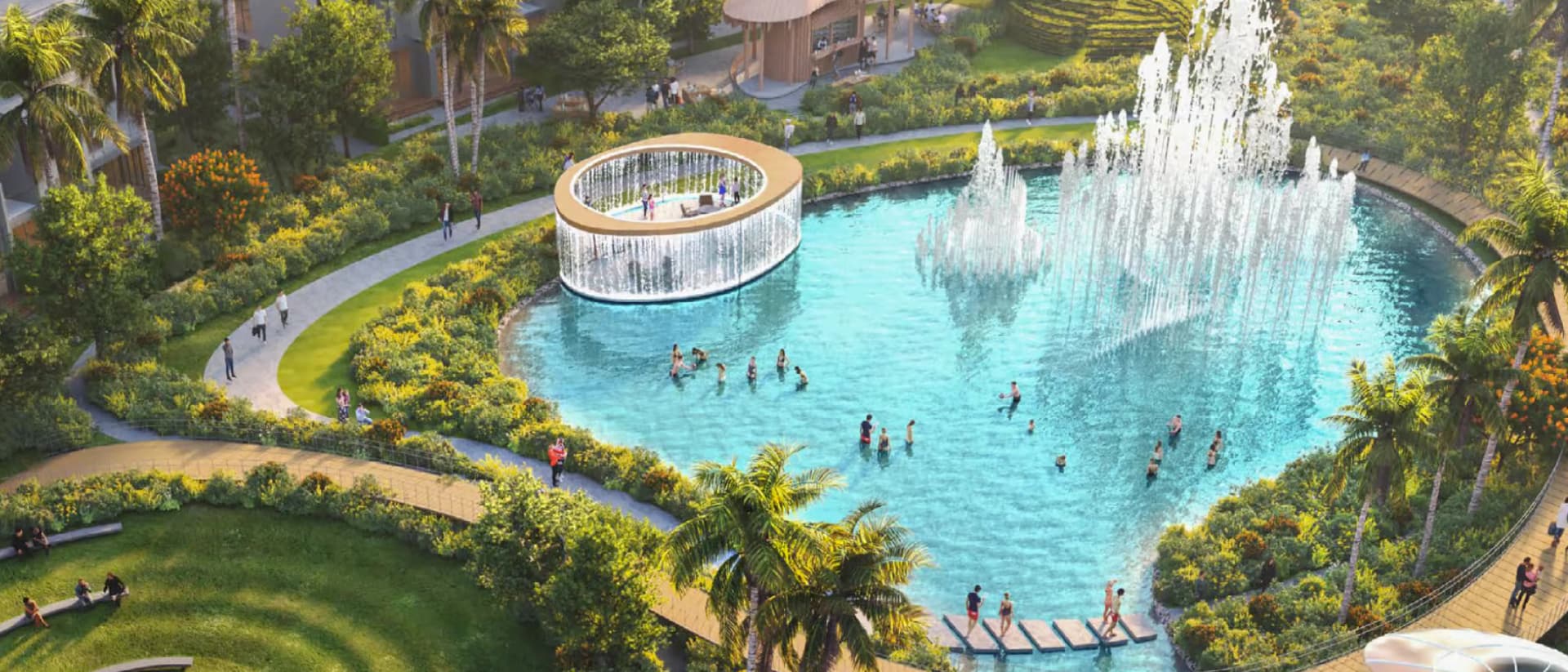 Aerial view of a lagoon with fountains and recreational areas