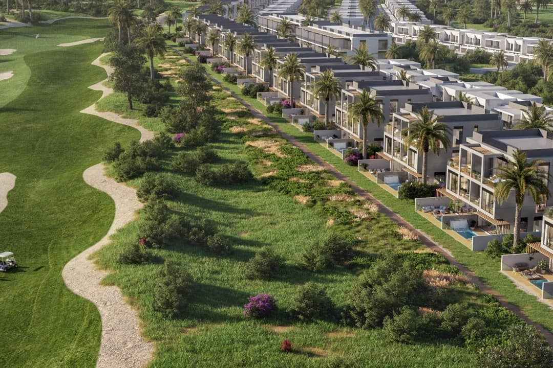 Aerial view of villas alongside lush green golf course