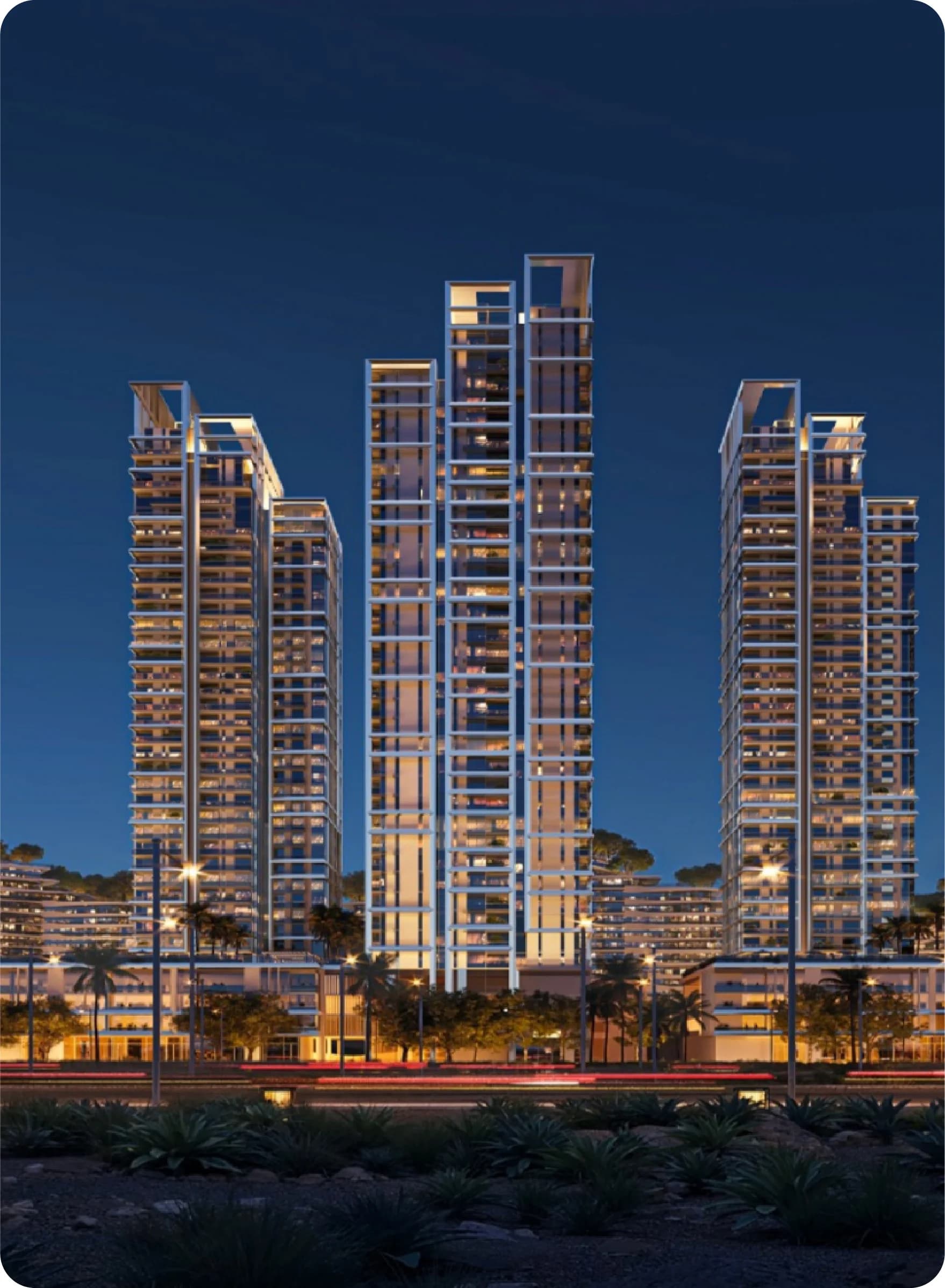 Contemporary apartment towers illuminated at night