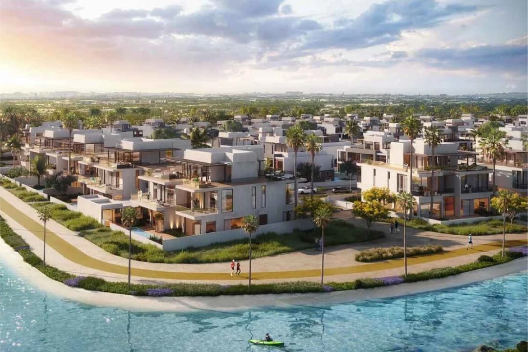 Luxurious villas by the waterfront with palm trees and walking paths
