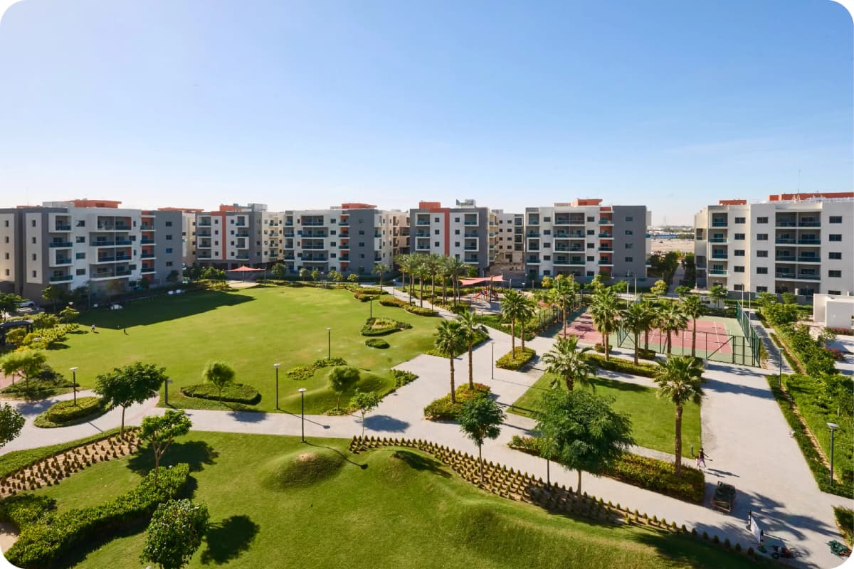 Residential community with greenery and tennis courts