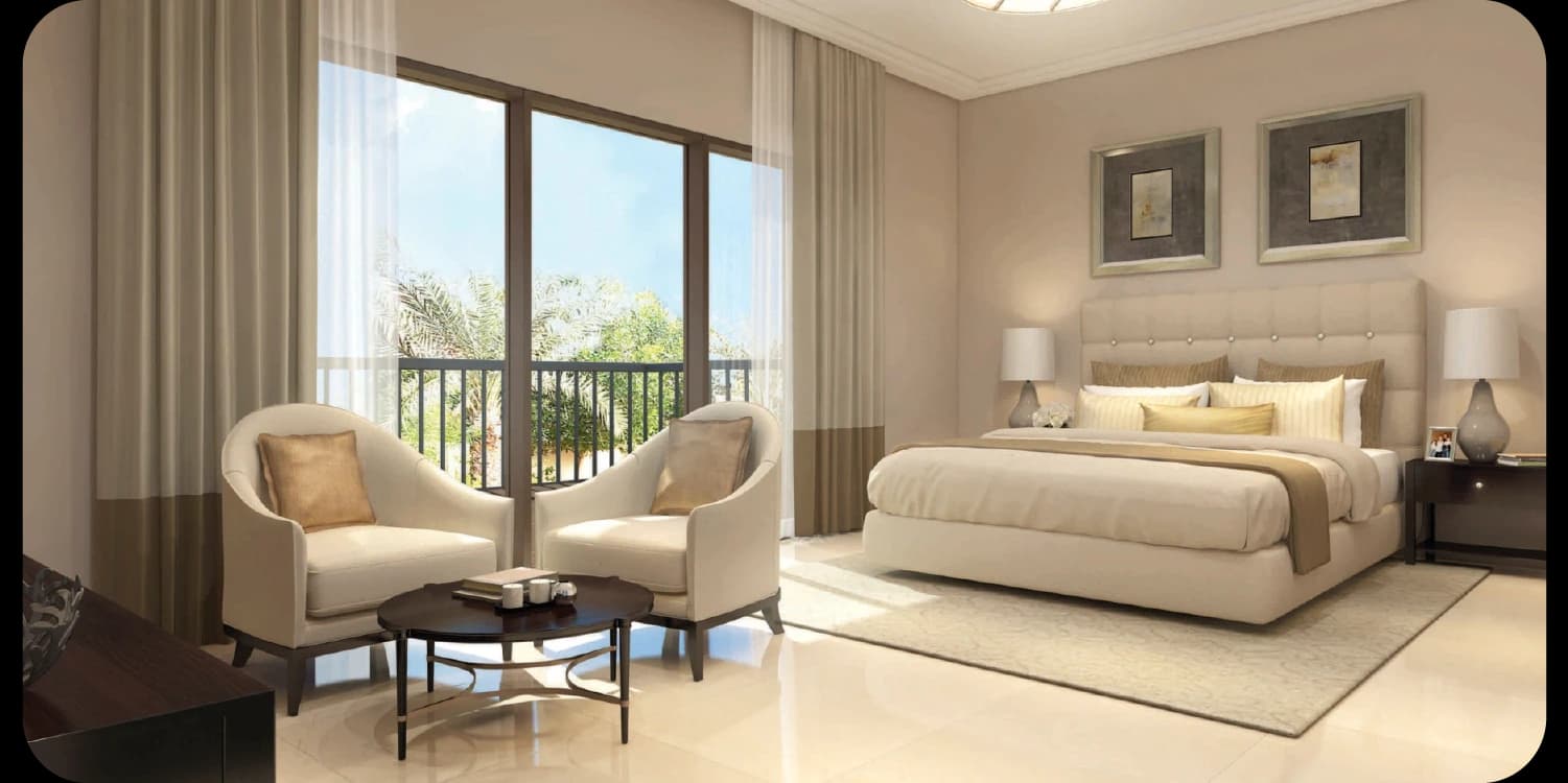 Neutral-toned bedroom with balcony and two armchairs