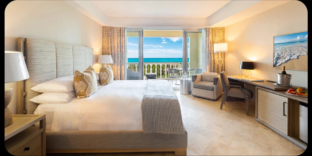 Cozy bedroom with neutral tones and ocean view