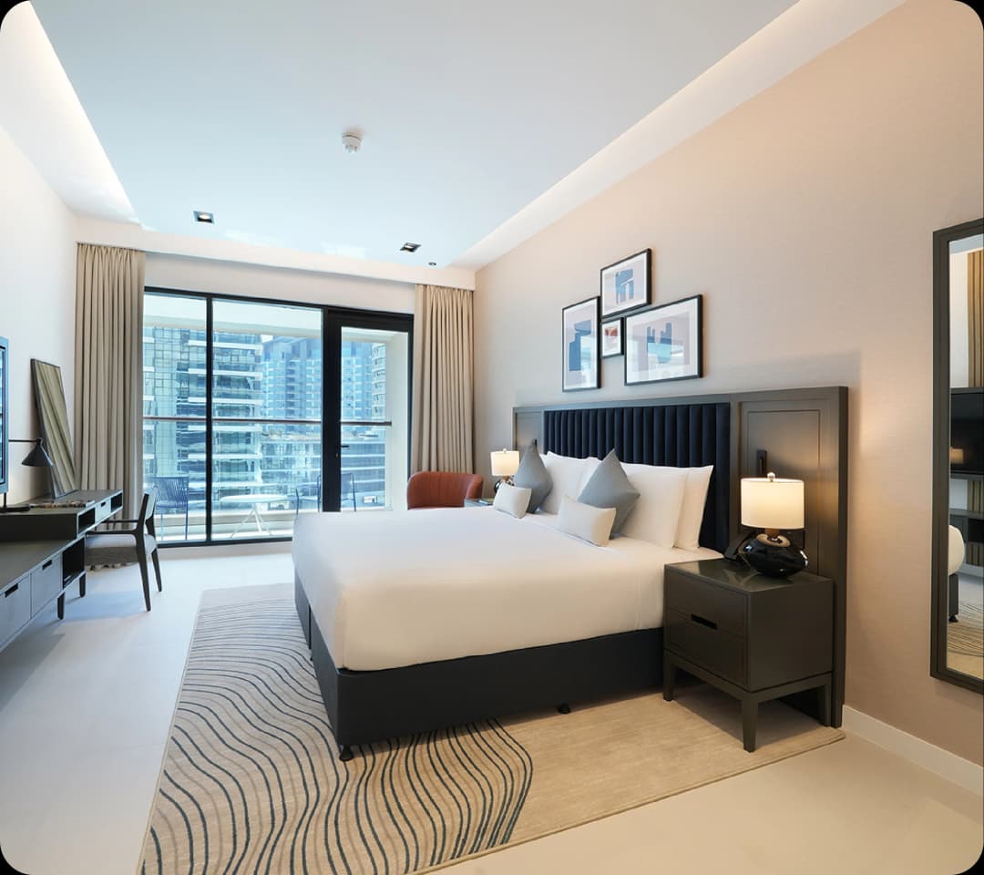 Bedroom with balcony and city view