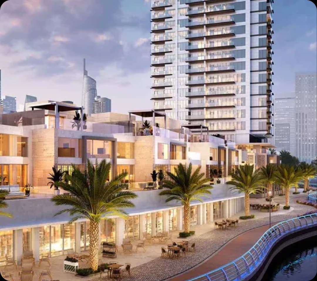 Modern waterfront development with high-rise and shops