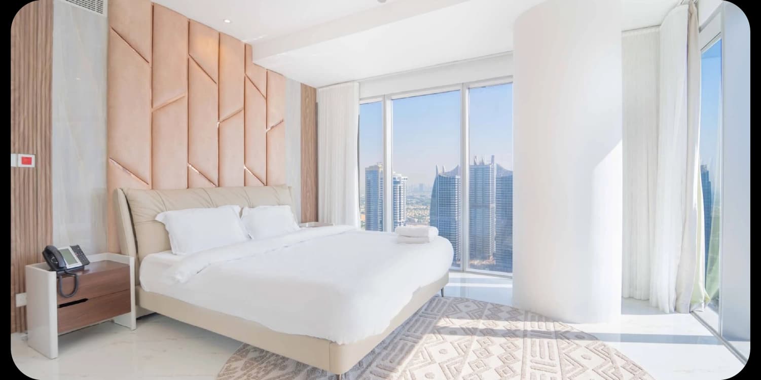 Bright, modern bedroom with city view