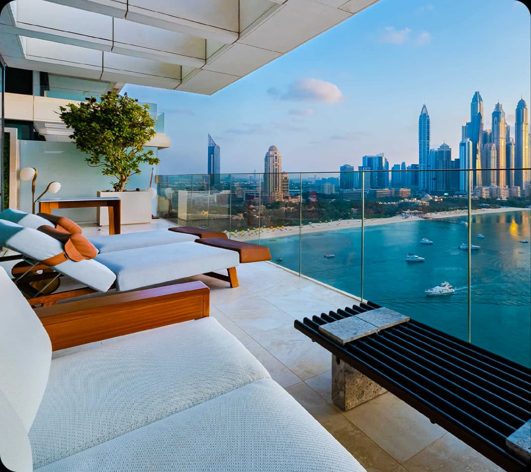 Luxury balcony with Dubai skyline and ocean view.