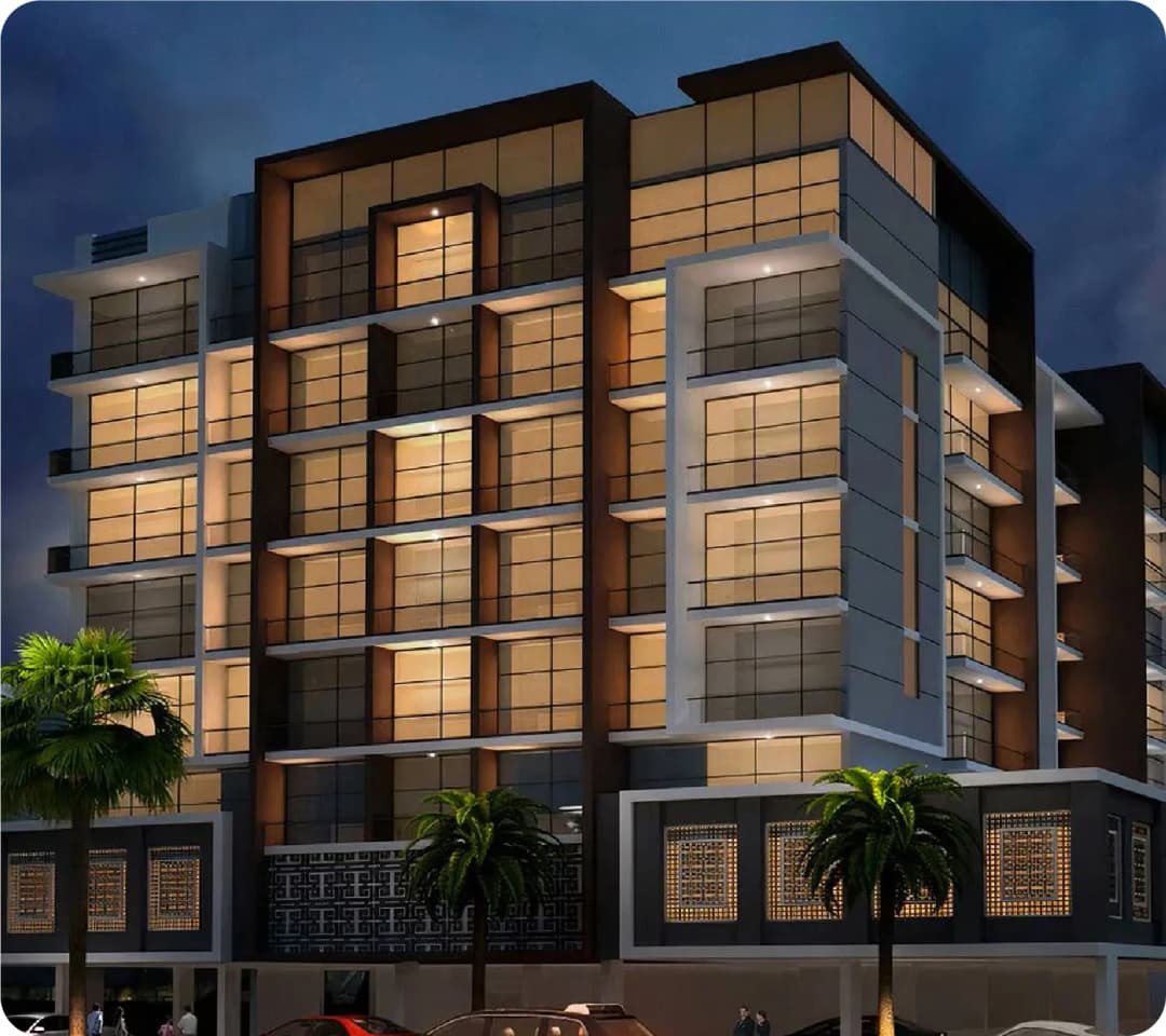 Modern building illuminated at dusk with palm trees