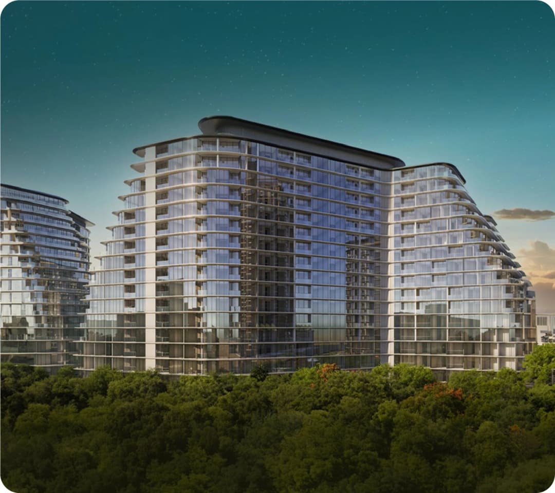 Modern glass apartment buildings surrounded by trees