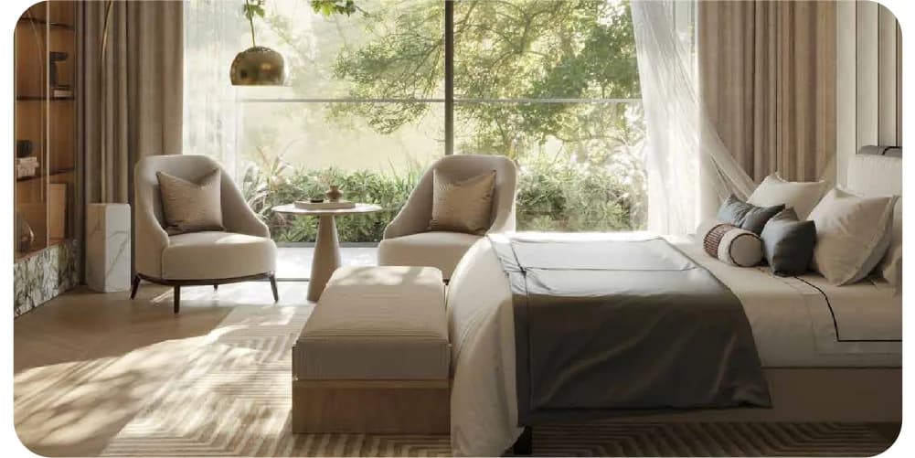 Elegant bedroom with cozy seating area and natural light