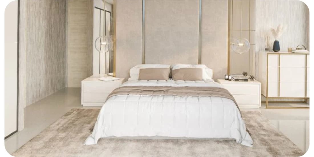A luxurious bedroom with a white bed and gold accents