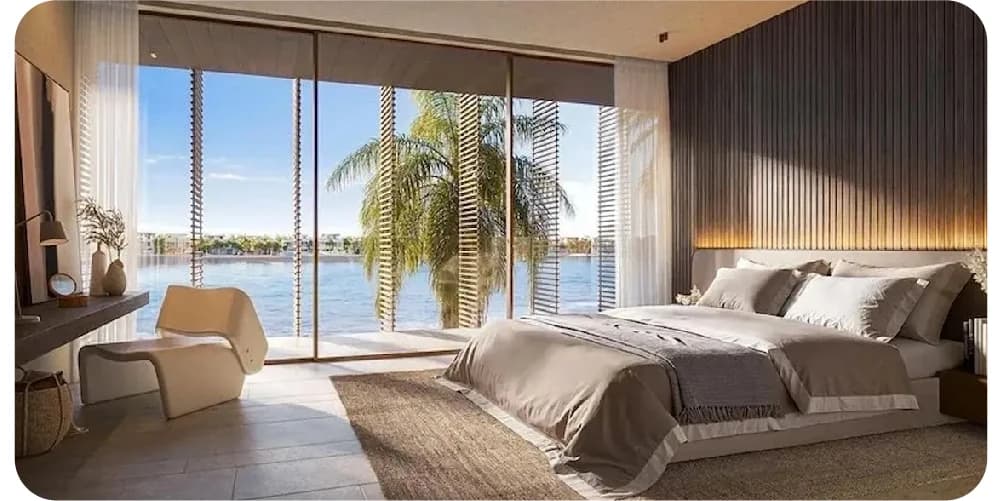 Serene bedroom with water view and palm tree