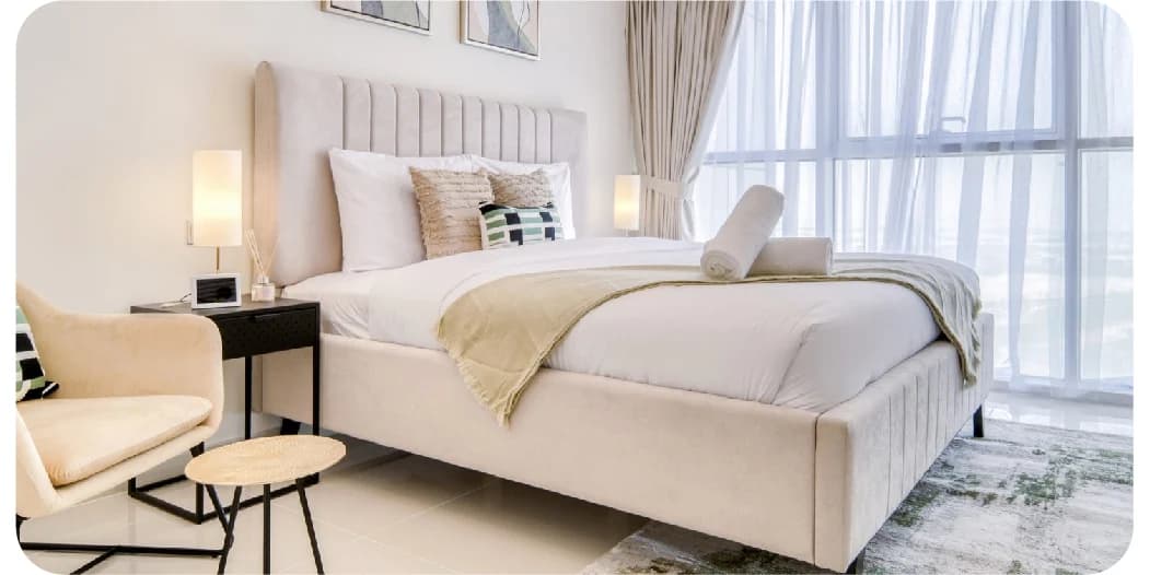 Elegant bedroom with a luxurious bed and ocean view