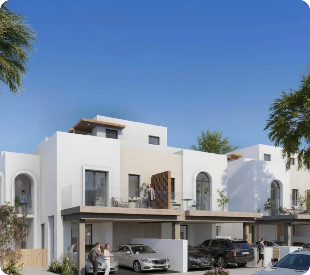 Modern townhouses with luxury cars parked outside