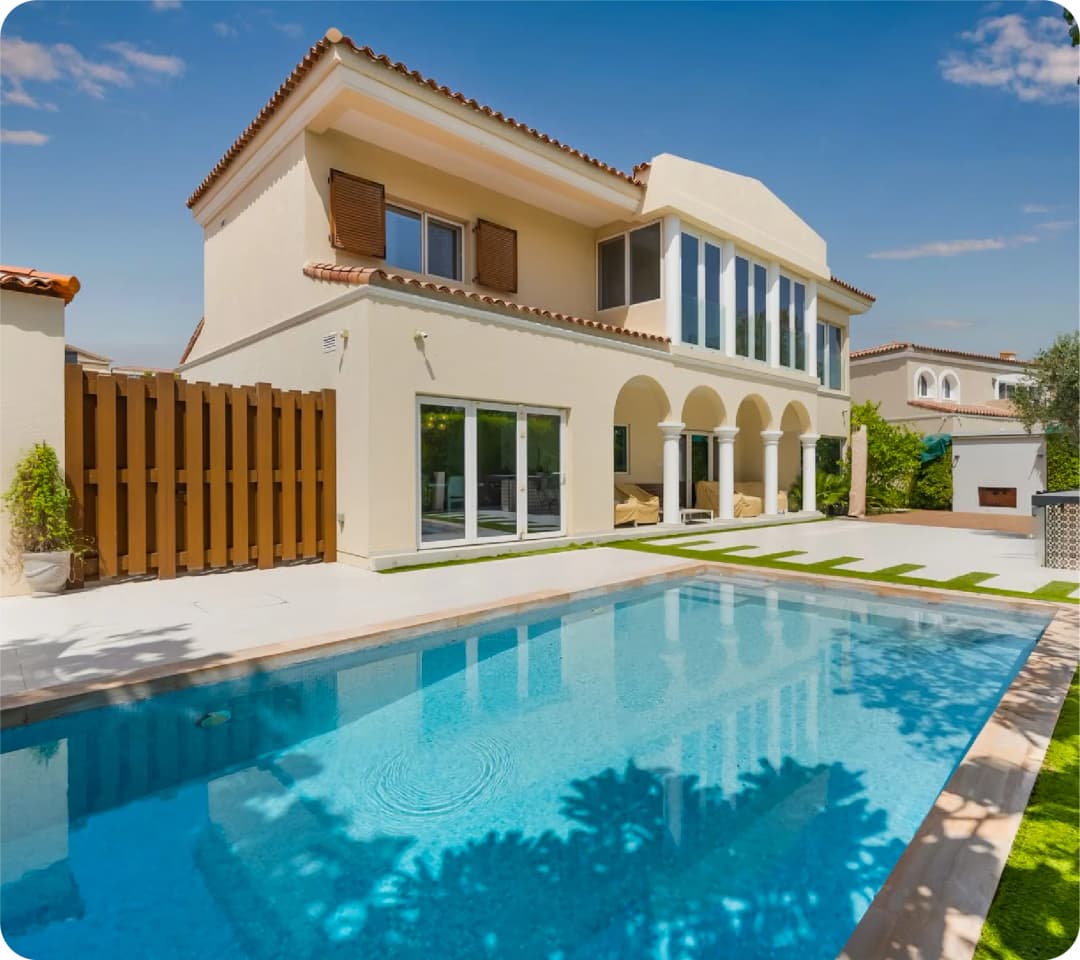 Beige villa with a pool in Green Community West