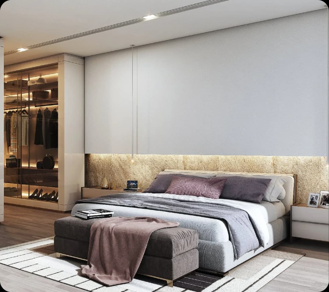 Modern bedroom with a large bed and walk-in closet