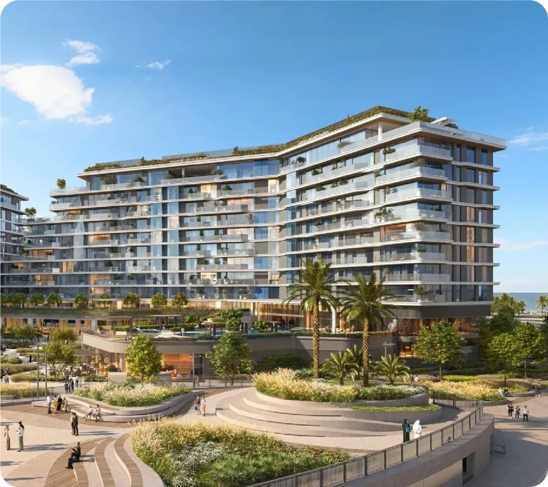 Large, modern building with balconies and greenery