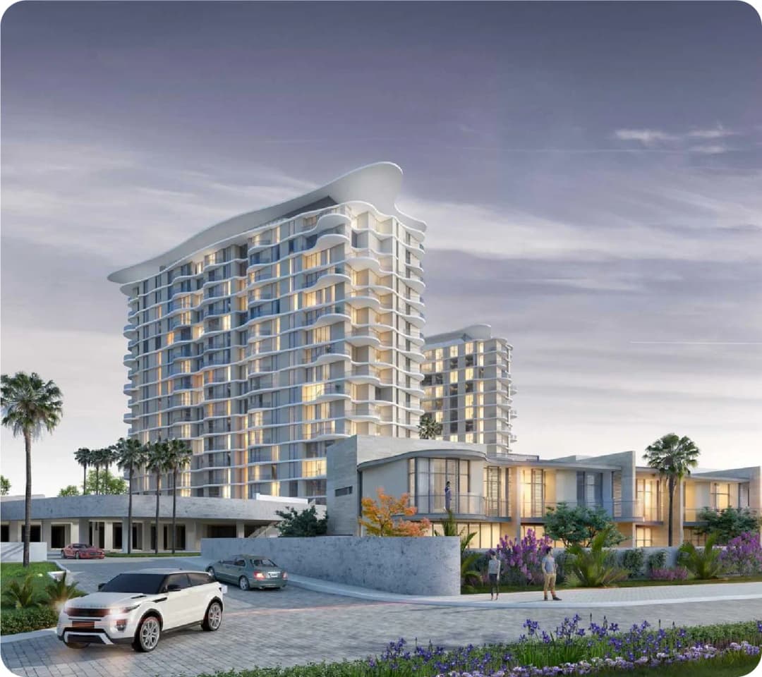 Modern residential building with palm trees and cars