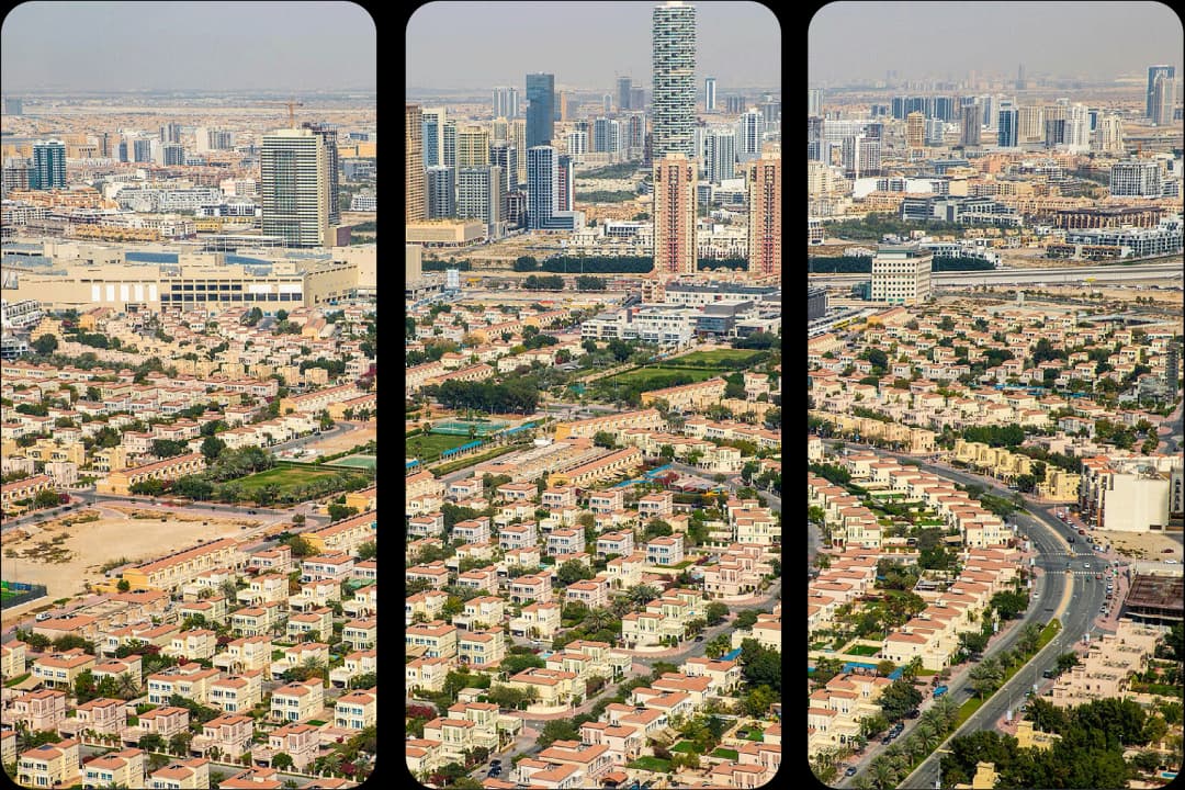 Suburban sprawl meets distant city skyline