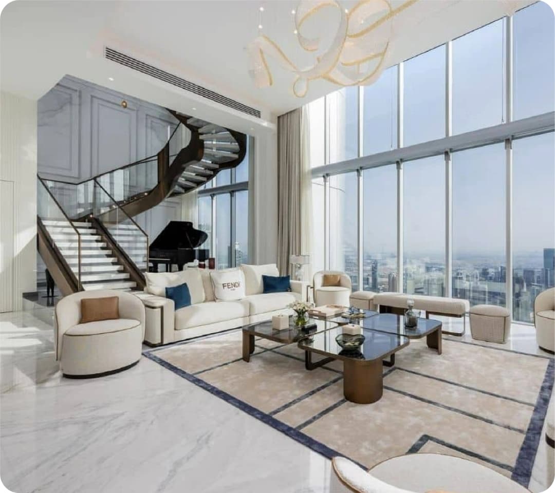 Modern living room with large windows and staircase
