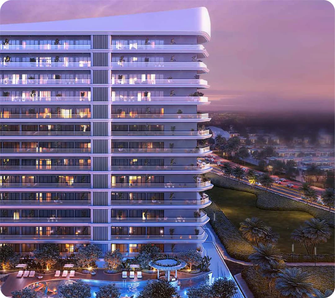 A modern, illuminated high-rise building at twilight