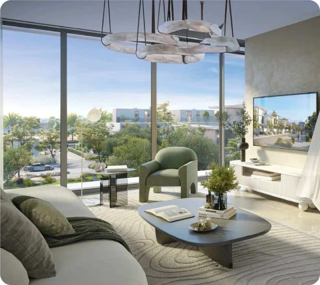 Bright modern living room with green armchair and large windows