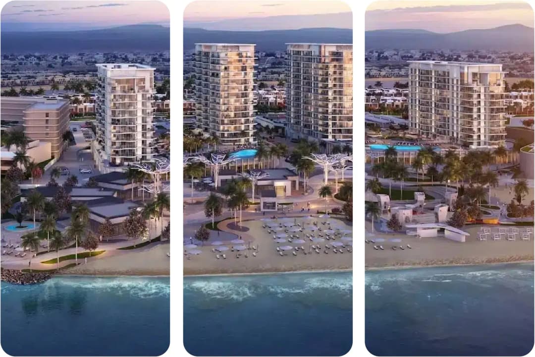 Aerial view of beachfront luxury towers with pools and lounges