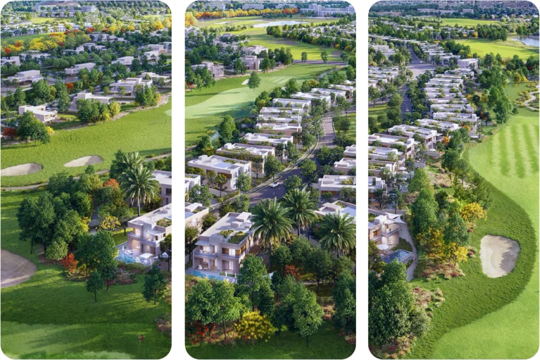 Aerial view of a lush residential community with villas near a golf course