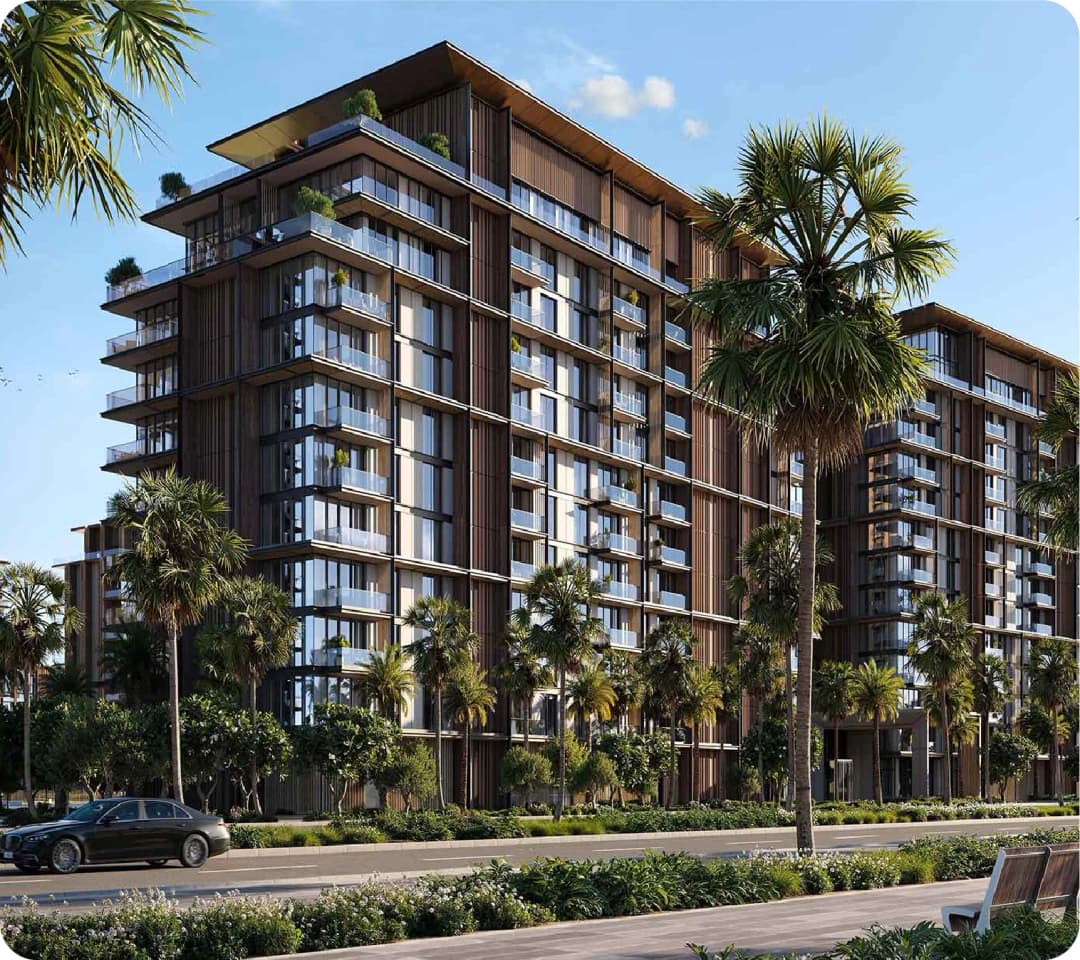 Luxury residential building with palm trees and clear skies