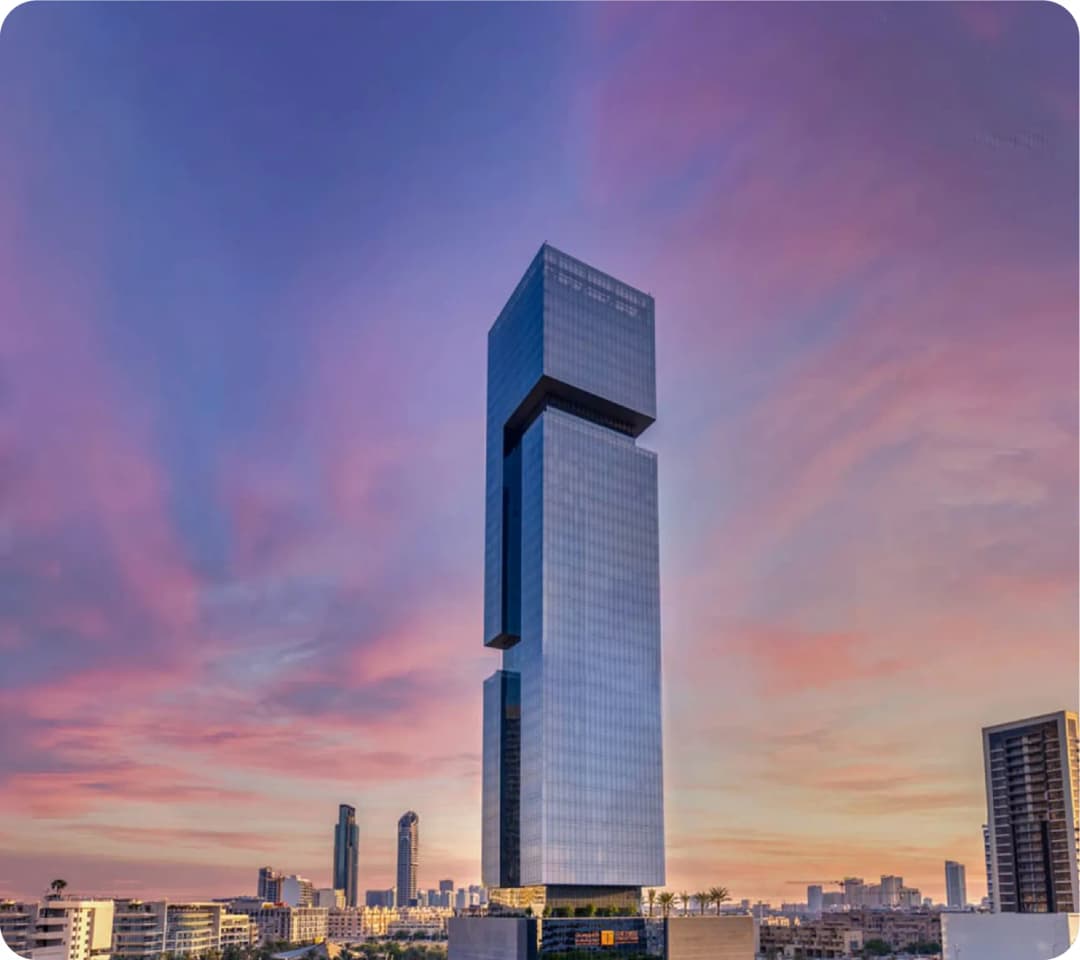 Modern skyscraper with a colorful sky at sunset