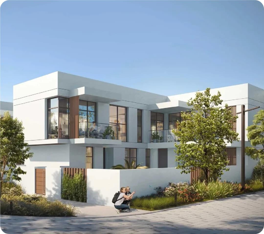 Modern villa exterior with greenery and photographer