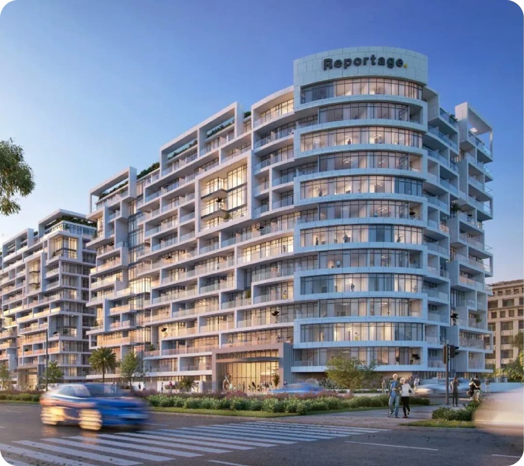 Modern white apartment building with curved balconies