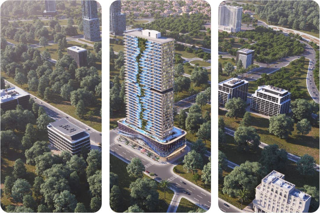Aerial view of a tall residential tower surrounded by greenery