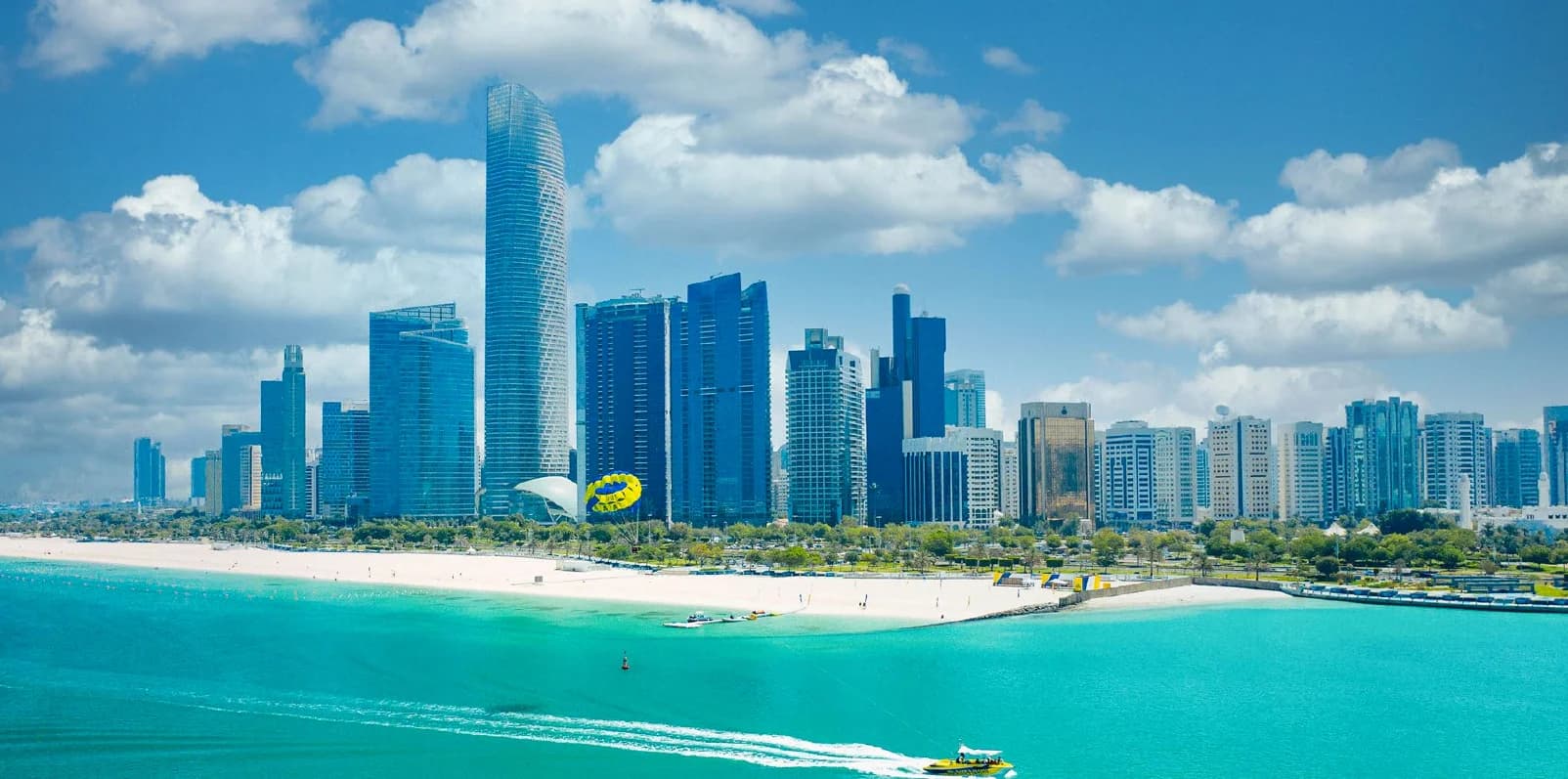 Aerial view of city skyline with modern buildings and a waterfront