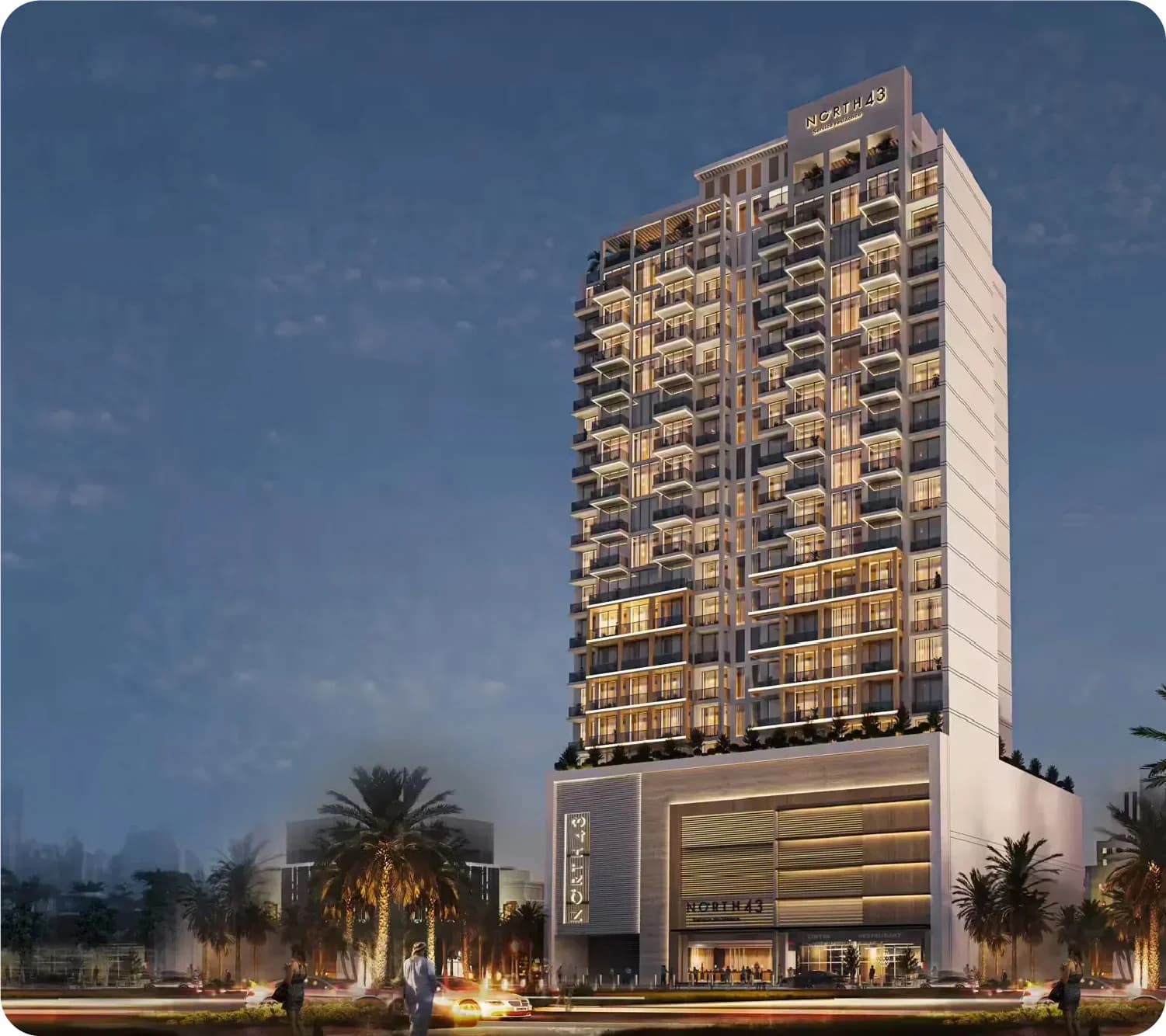 Aerial view of a modern twin-tower building with a pool and recreational area